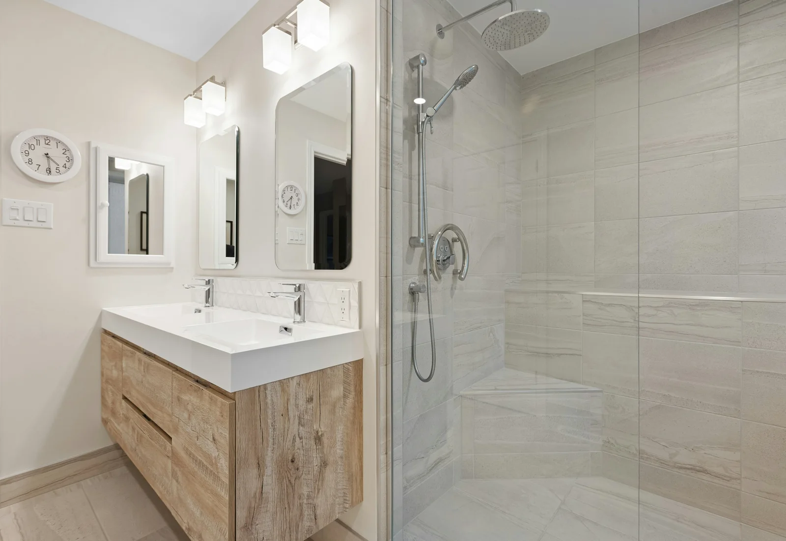 Light neutral bathroom with glass shower and tiled walls