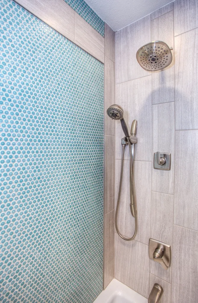 Blue glass mosaic shower wall