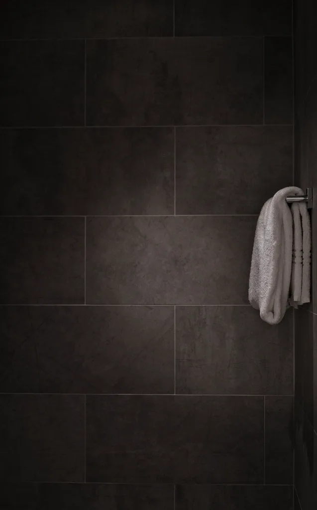 Matt charcoal wall tile — joint detail